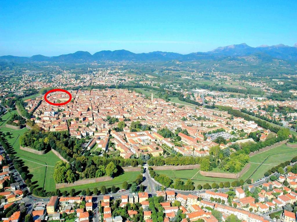 an aerial view of a city with a red circle at Charming Mansion in Lucca in Lucca