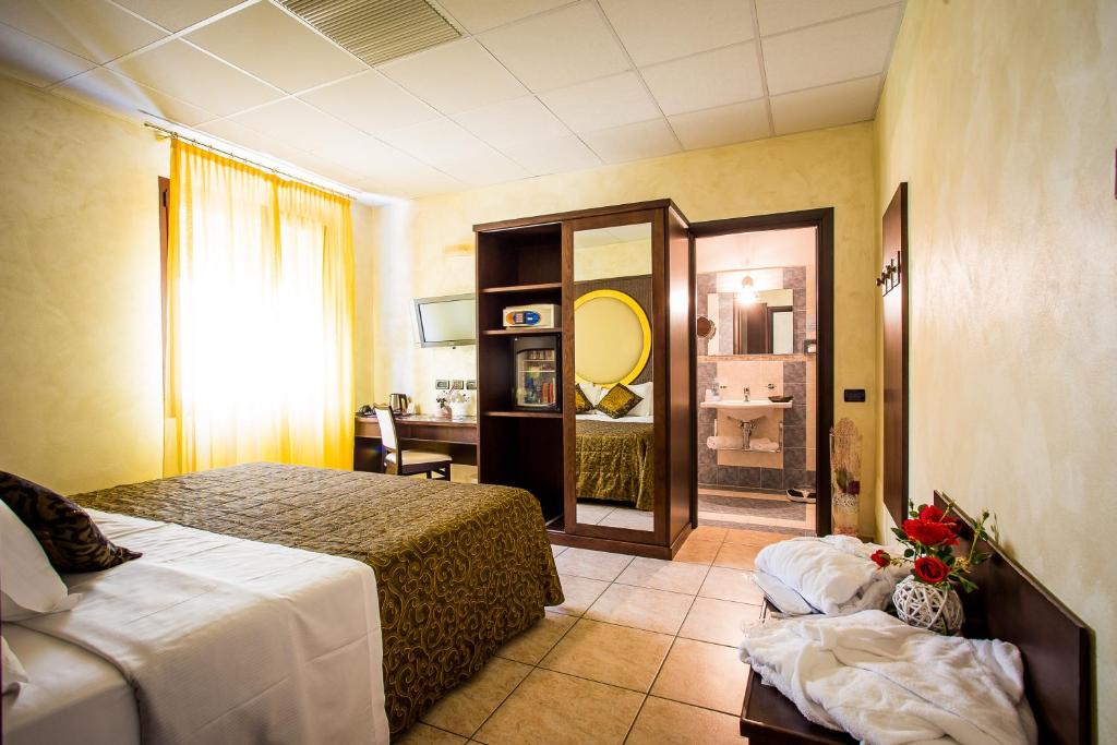 Postel nebo postele na pokoji v ubytování Piccolo Hotel Nogara