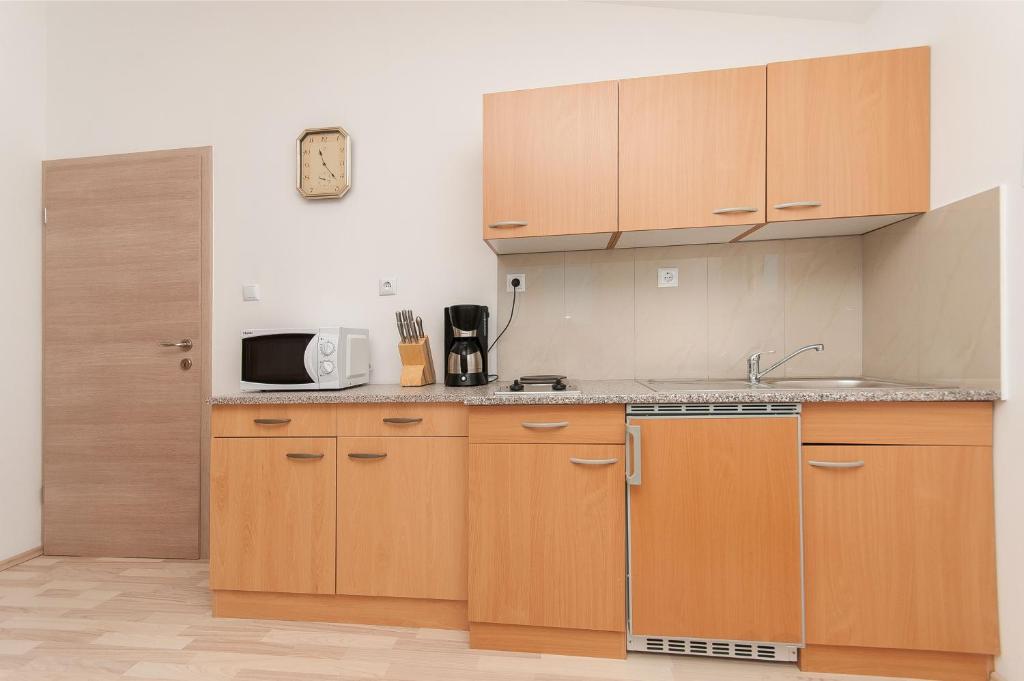 Kuchyň nebo kuchyňský kout v ubytování Apartmani Vesna