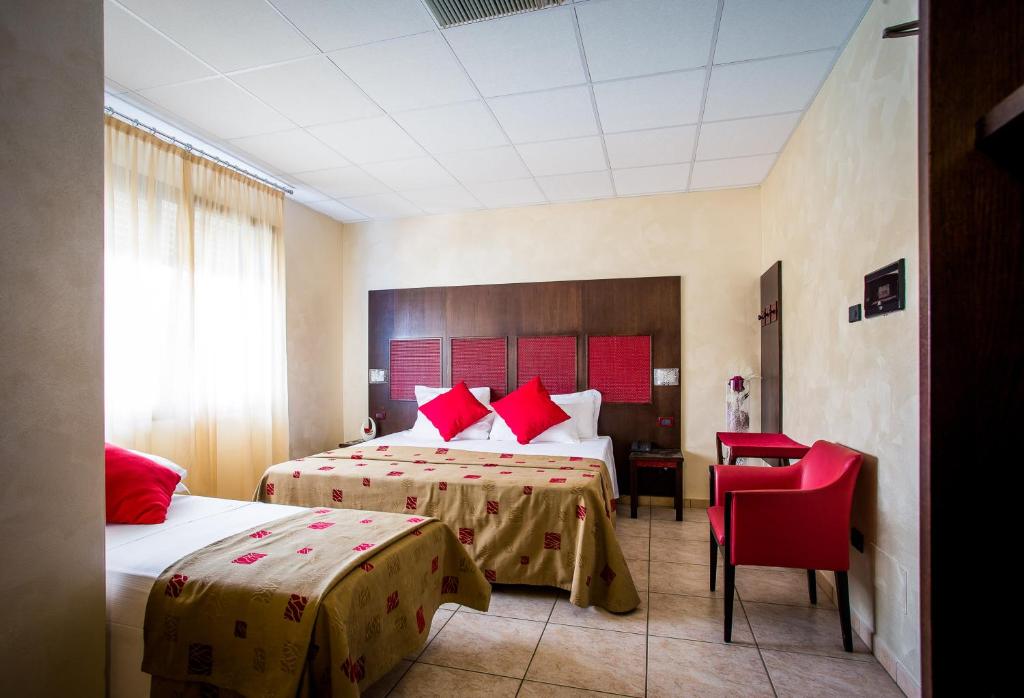 Postel nebo postele na pokoji v ubytování Piccolo Hotel Nogara