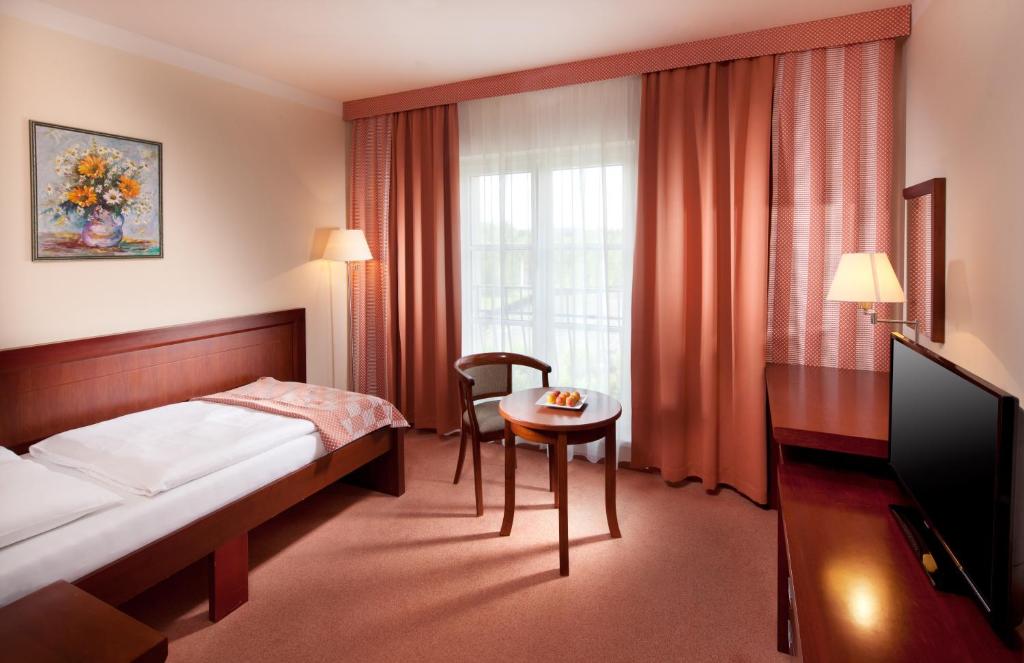 Postel nebo postele na pokoji v ubytování Francis Palace