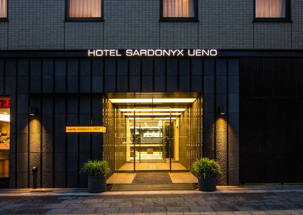a building with a sign on the front of it at Hotel Sardonyx Ueno in Tokyo