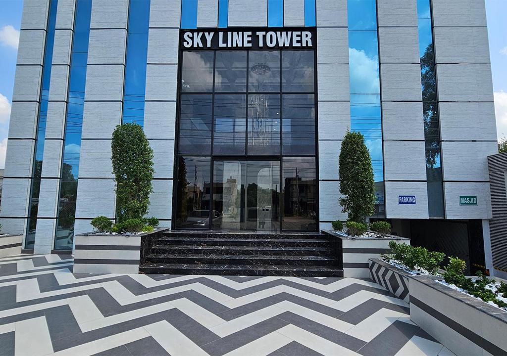 a building with a sky line tower sign on it at Skyline Hotel in Sargodha