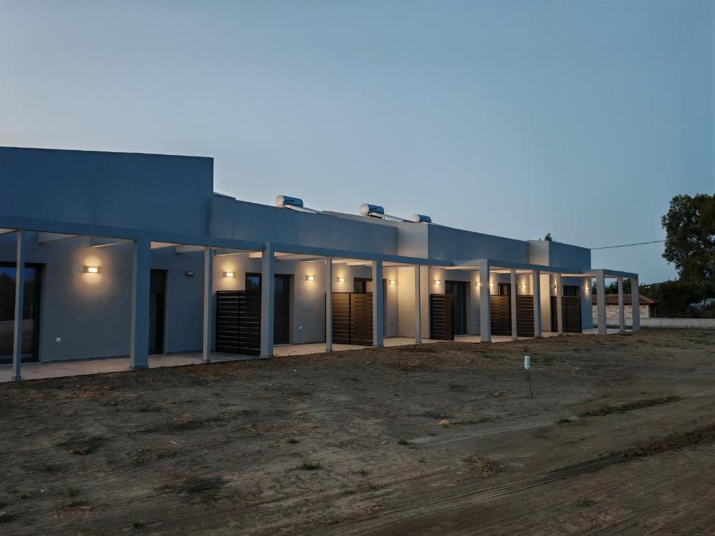 a large building with a lot of stalls at Olympic Flame Suites in Pyrgos