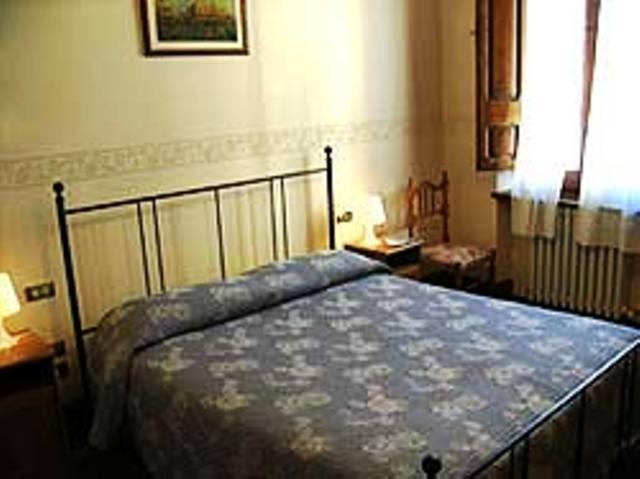 A bed or beds in a room at B&B Santa Chiara