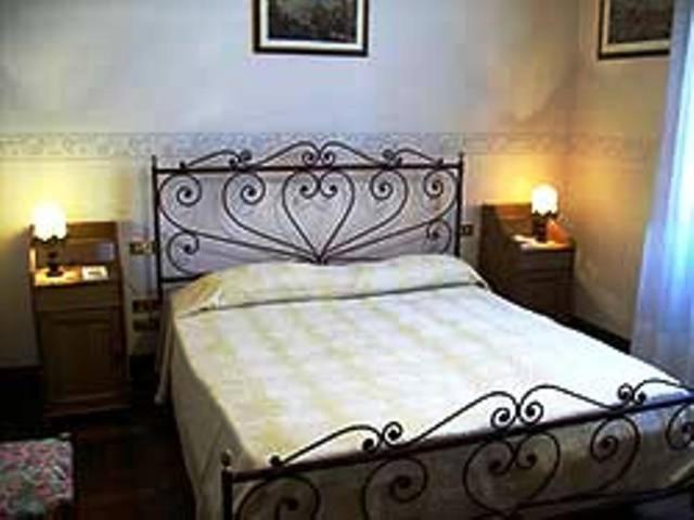 A bed or beds in a room at B&B Santa Chiara
