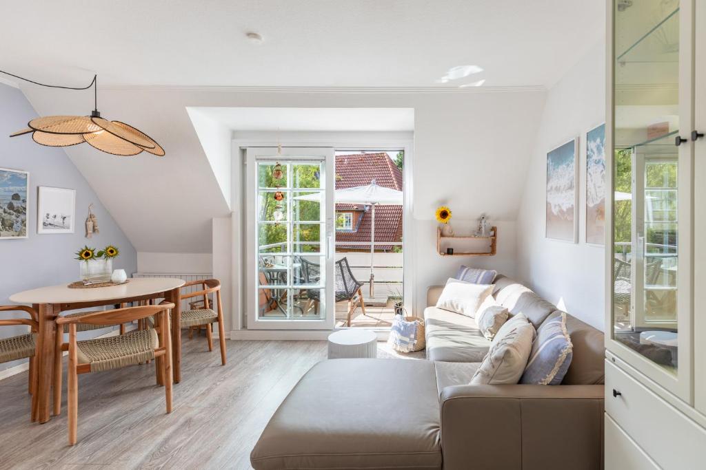 a living room with a couch and a table at Wellenklang in Böhl