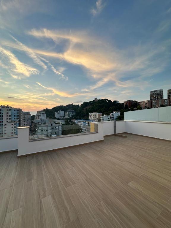 an empty balcony with a view of a city at Amea Apartments in Durrës