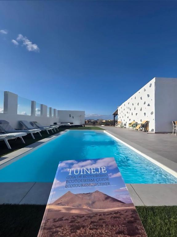 a view of a swimming pool on the roof of a building at Villa Gozo Holiday house in Teguitar