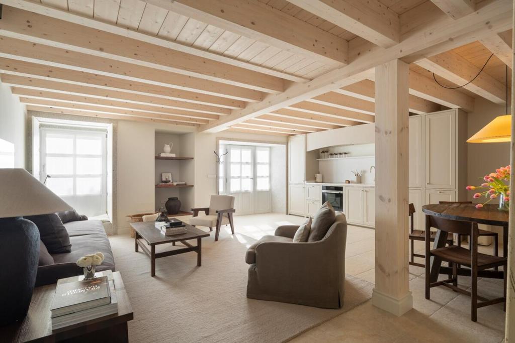 a living room with a couch and a table at Casa Conde in Furelos