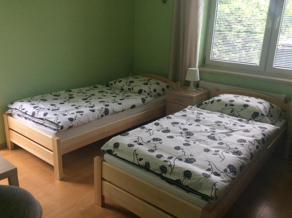 Posteľ alebo postele v izbe v ubytovaní Gdynia Orłowo Pokoje Gościnne u Stasia