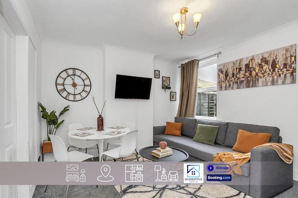 a living room with a couch and a table at Wherstead Rd House By Homestyles Hosts Short Lets & Serviced Accommodation Suffolk With Free Parking in Ipswich