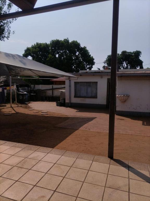 a building with a tent in front of it at Sunflower Stays in Pretoria
