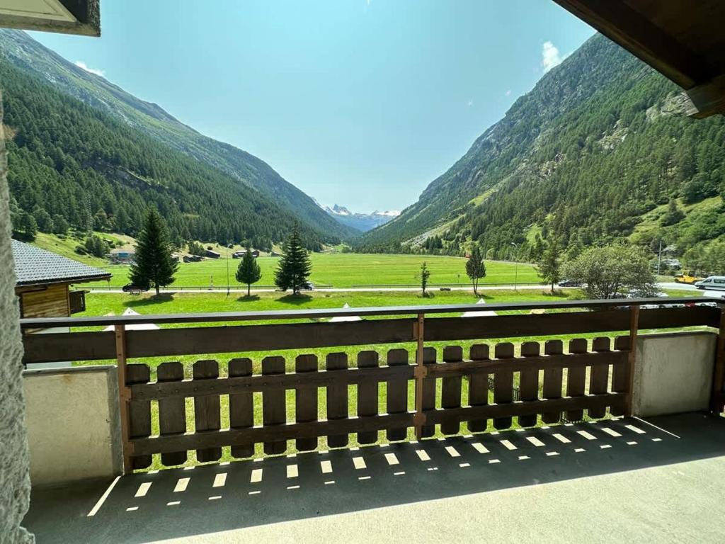 a view from the balcony of a house with mountains at Mountain Majesty Apartment with Stunning Views in Täsch