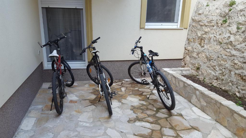 two bikes parked next to each other in front of a building at Apartments Old Bridge in Mostar
