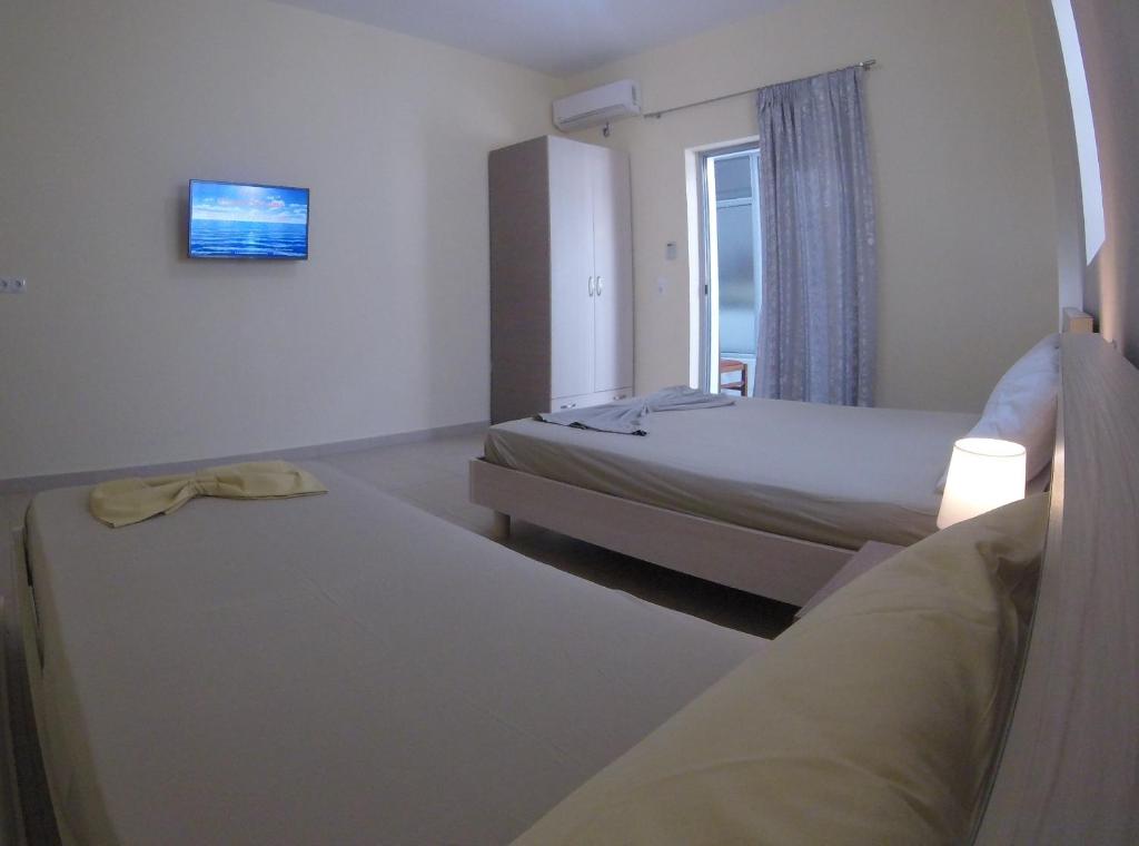 Postel nebo postele na pokoji v ubytování Riviera Rooms