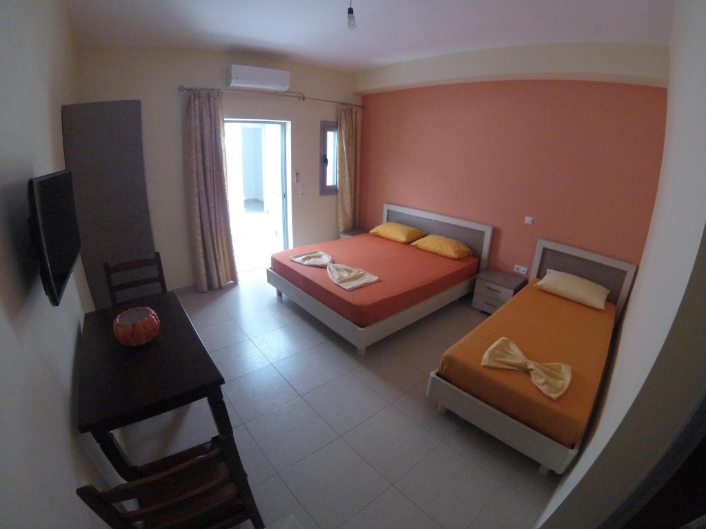 Postel nebo postele na pokoji v ubytování Riviera Rooms