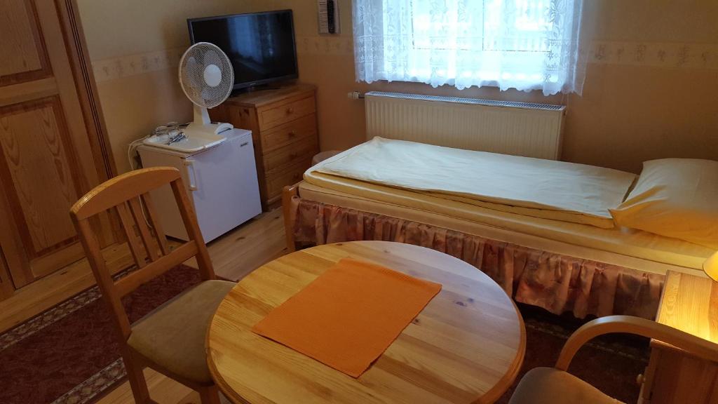 TV a/nebo společenská místnost v ubytování Villa Johanna Guesthouse