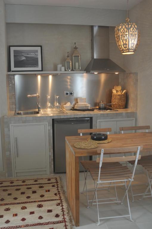 Kuchyň nebo kuchyňský kout v ubytování Apartamentos Caravane