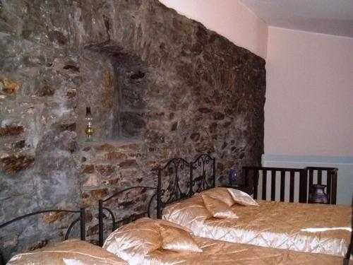 Postel nebo postele na pokoji v ubytování Agriturismo La Palombara