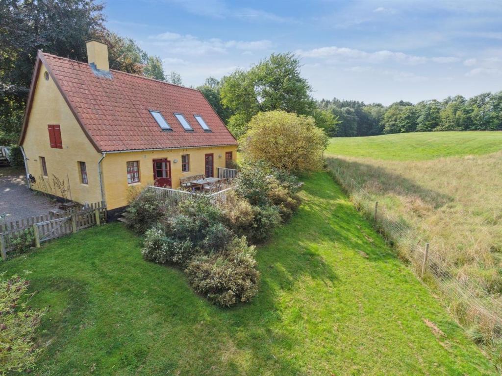 an aerial view of a house in a field at Holiday Home Waldemar - 8km from the sea by Interhome in Gudhjem