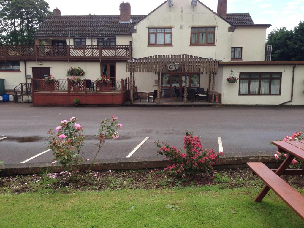 a parking lot in front of a building at The Woolaston Inn in Lydney