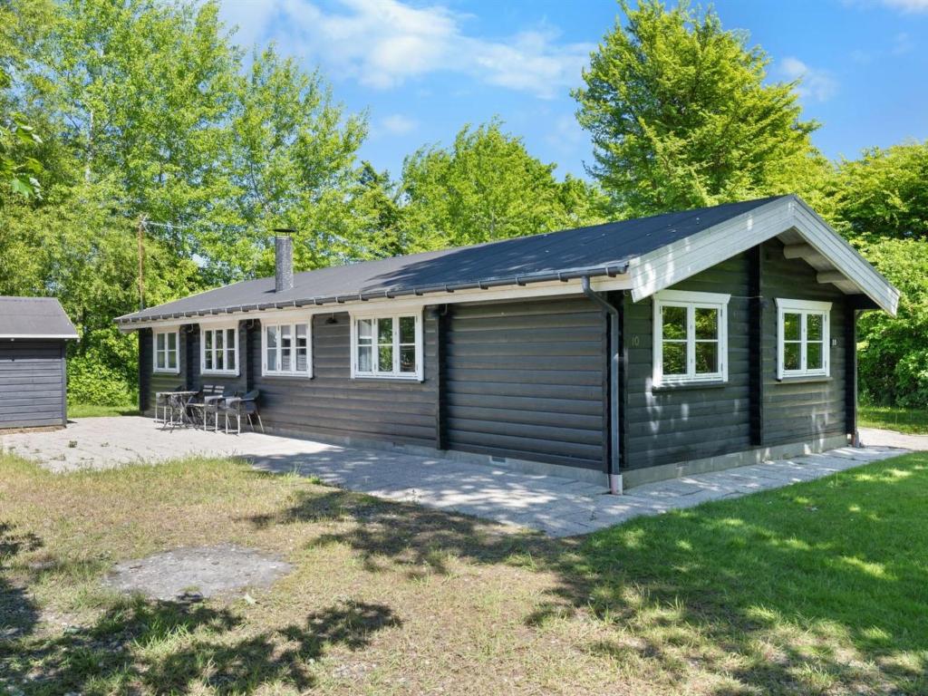 a tiny house with a garage at Holiday Home Doris - 150m from the sea by Interhome in Tranekær