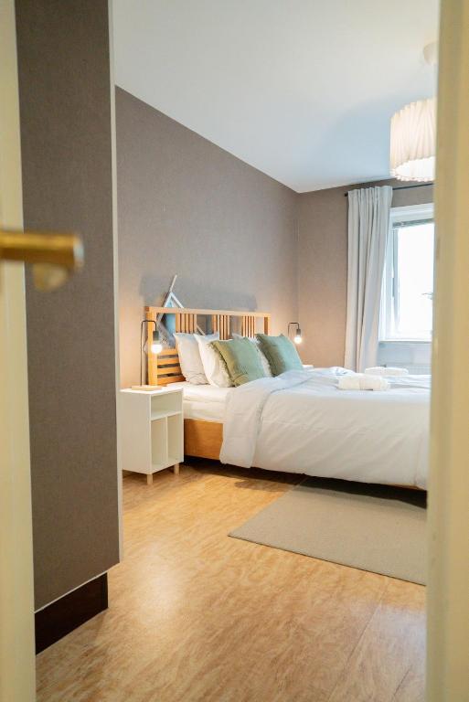 Ένα ή περισσότερα κρεβάτια σε δωμάτιο στο Large City-Centre Apartment