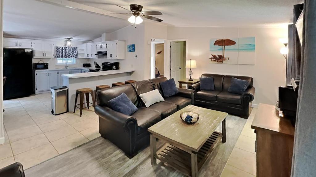 a living room with a couch and a table at Put-in-Bay Island Club #97 in Put-in-Bay