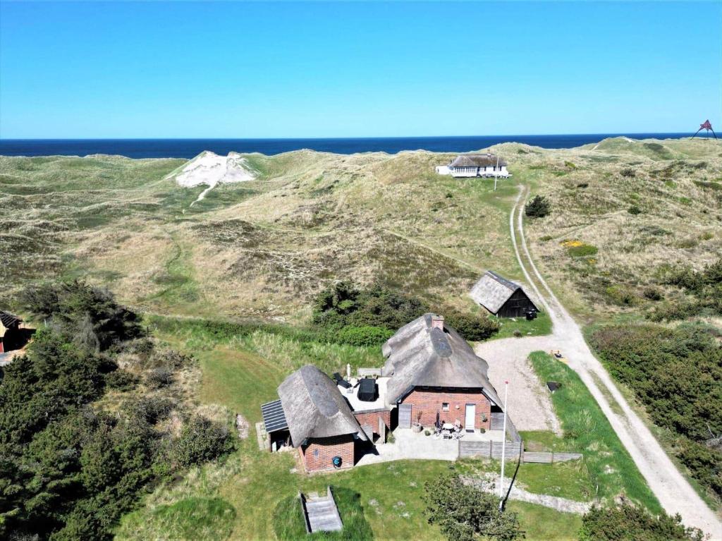 an old house on a hill near the ocean at 20169-Ulfborg-Vederso-Klitvej-37-B in Vedersø Klit