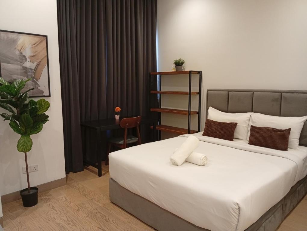 Ένα ή περισσότερα κρεβάτια σε δωμάτιο στο Luxury Suites By Lucentia Residences BBCC