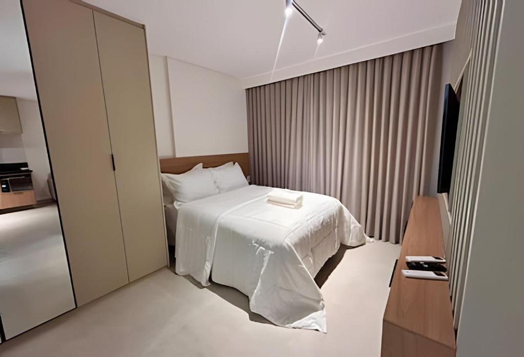 Ένα ή περισσότερα κρεβάτια σε δωμάτιο στο Suíte Clean Premium By Boss