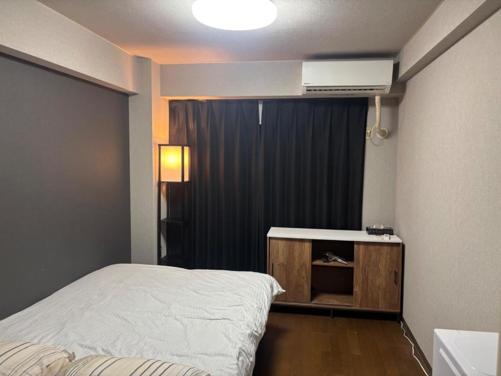 เตียงในห้องที่ LEGALCOURT - Vacation STAY 18996