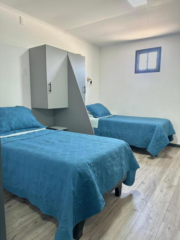 Ένα ή περισσότερα κρεβάτια σε δωμάτιο στο Aloha-Te Tierra Amarilla