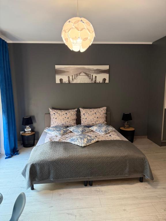Postel nebo postele na pokoji v ubytování Apartament Oslo