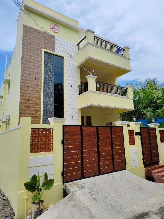 a house with a gate in front of it at Ecstasy Homestay Puducherry in Pondicherry