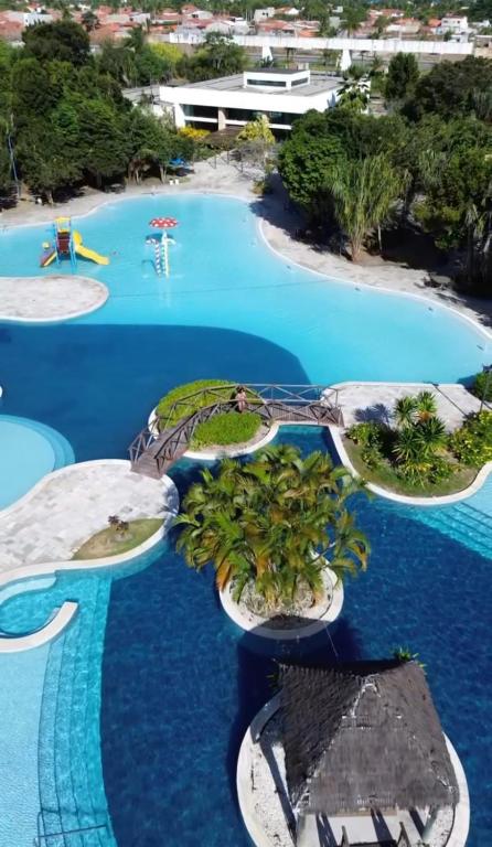 an aerial view of a resort swimming pool at Top Apto Iloa Equipado H in Barra de São Miguel
