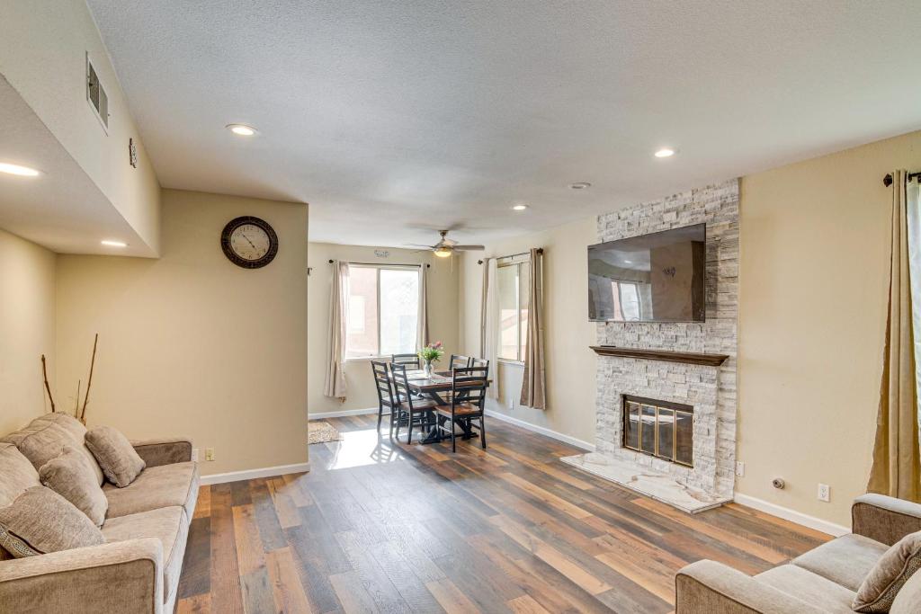 a living room with a couch and a fireplace at Walk to Olive View Medical Home with Pool Access! in Olive View