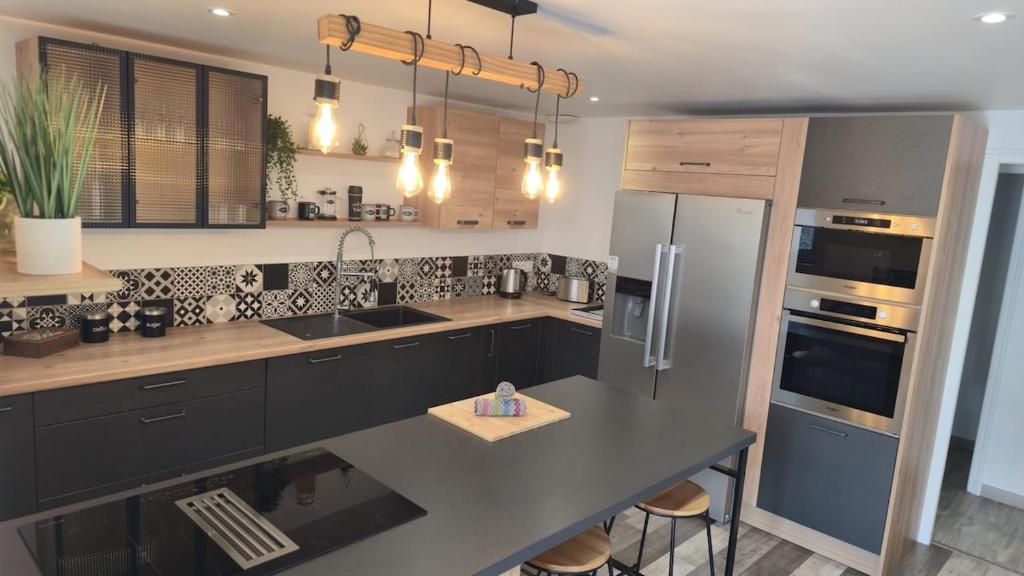 Dapur atau dapur kecil di Le Petit Caporal - Cour privée