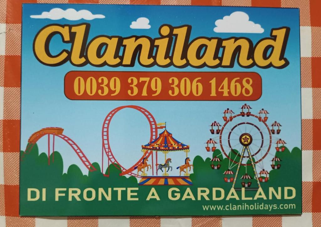 a sign for a carnival at an amusement park at Claniland in Castelnuovo del Garda