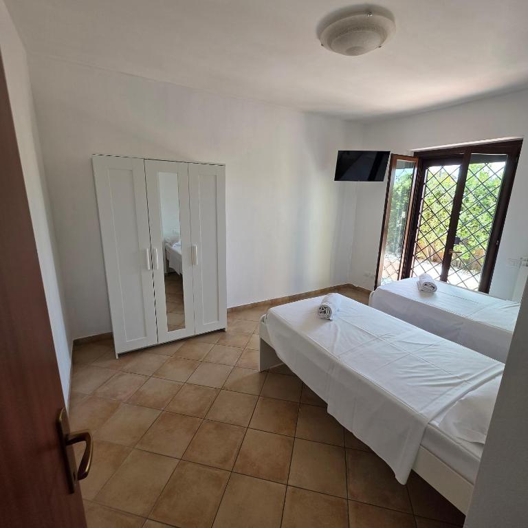 Ένα ή περισσότερα κρεβάτια σε δωμάτιο στο Villa Claudia
