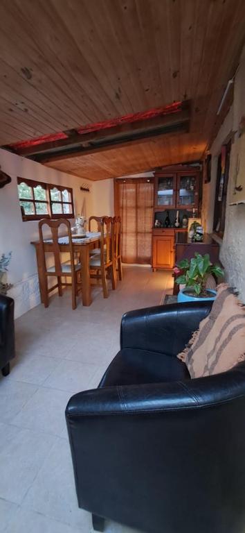 a living room with a couch and a table at Mi Rancho La Paloma in La Aguada