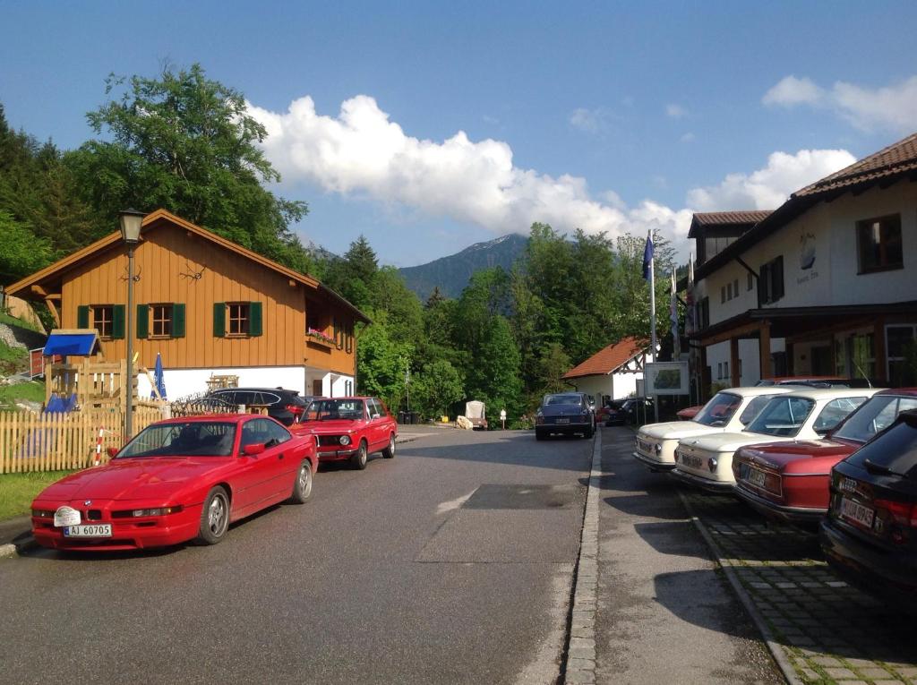 a group of cars parked on the side of a street at Am Berg-Ferienwohnung in Ettal
