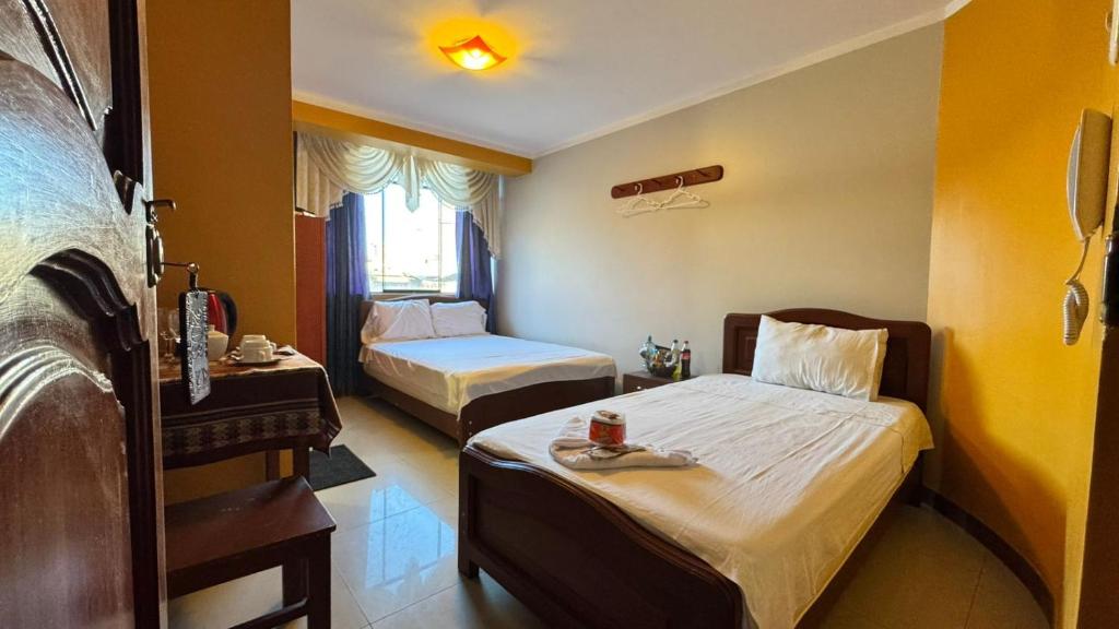 En eller flere senge i et værelse på Alojamiento en habitación