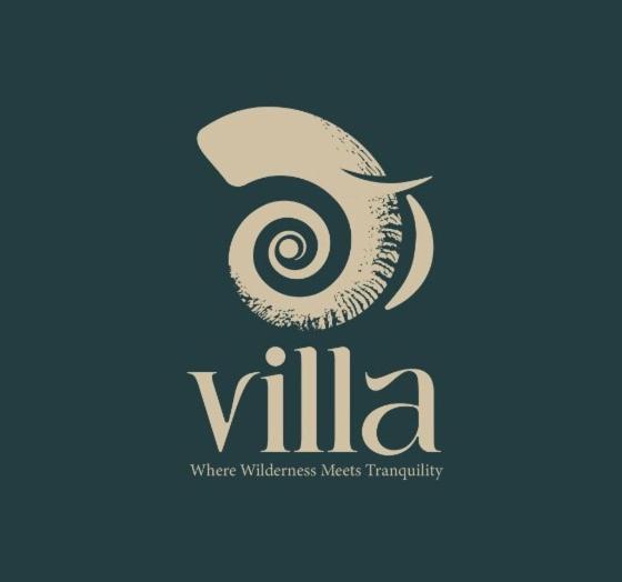 a logo for a company with a spiral symbol at MaVilla in Habarana
