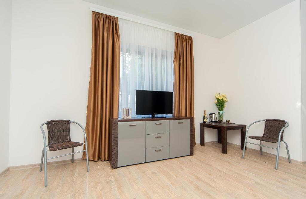 TV a/nebo společenská místnost v ubytování Hotel Fusion
