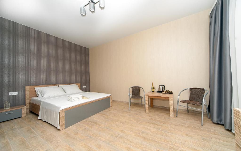 Postel nebo postele na pokoji v ubytování Hotel Fusion