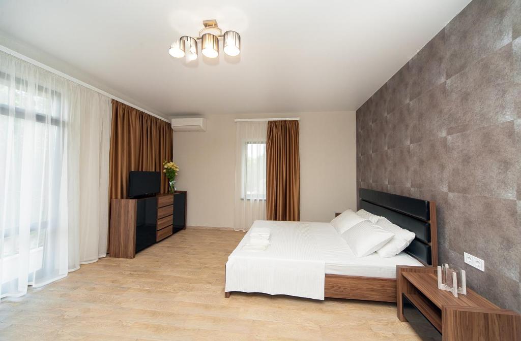 Postel nebo postele na pokoji v ubytování Hotel Fusion