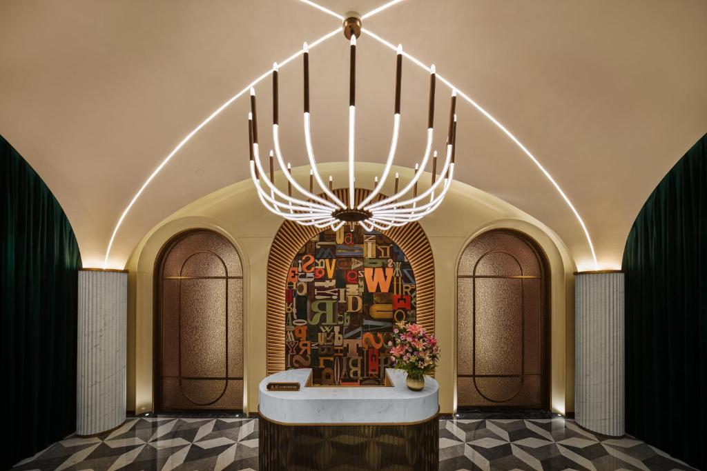 a large menorah in a building with a wall at Hotel Indigo Harbin Central Avenue by IHG in Harbin