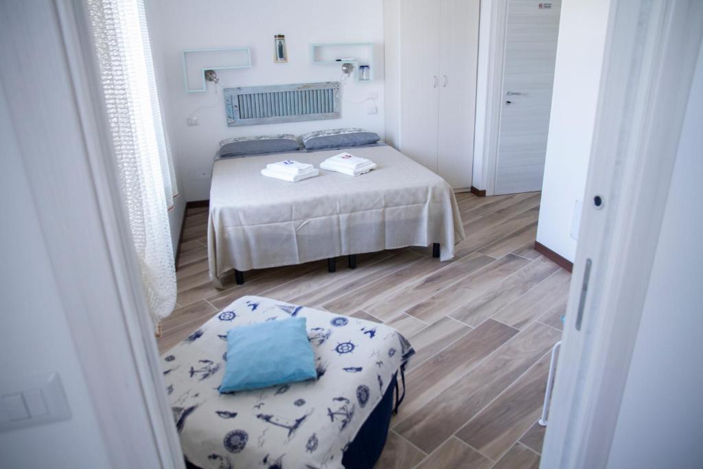 Postel nebo postele na pokoji v ubytování B&B Castello